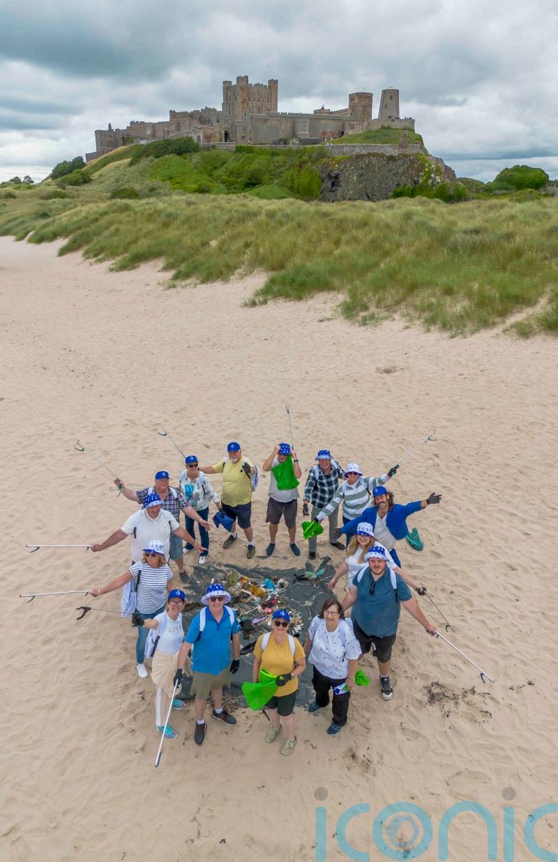 Lottery winners join beach clean-up to ‘give something back’