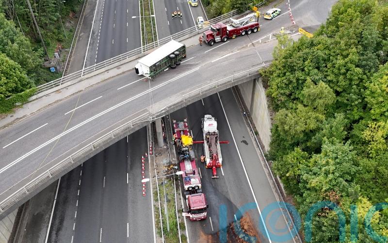 Man seriously injured after tractor falls onto motorway from bridge