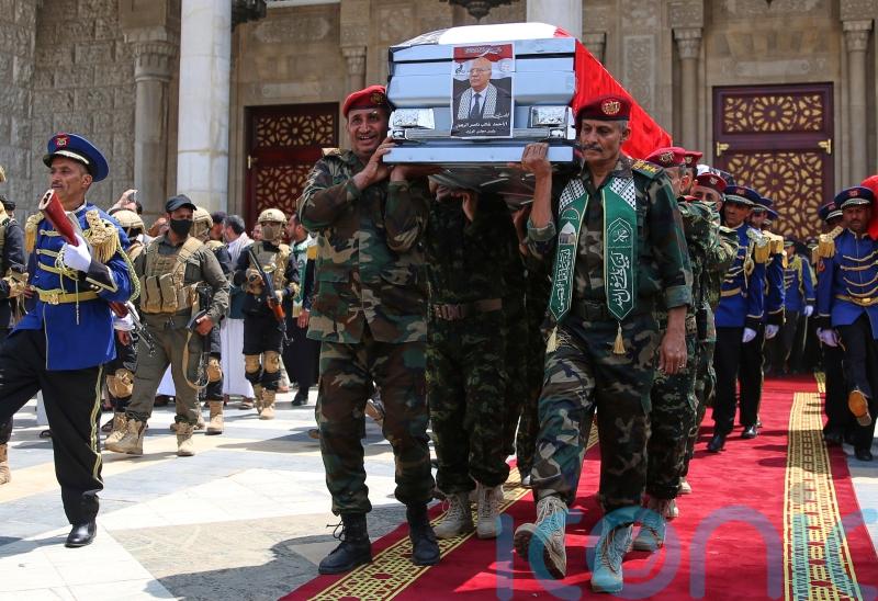 Yemenis mourn Houthi prime minister as rebel group targets ship in Red Sea