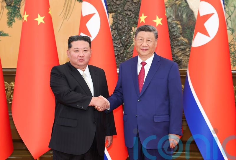 China’s Xi and North Korea’s Kim pledge deeper ties during meeting in Beijing