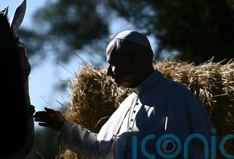 Pope feeds fish and pats horses as he opens Vatican’s sustainable farming centre