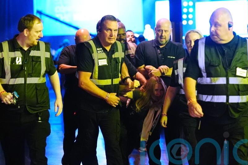 Climate protesters removed from Reform conference after heckling Nigel Farage