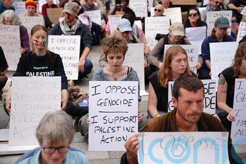 Protesters defy police warnings with signs supporting Palestine Action
