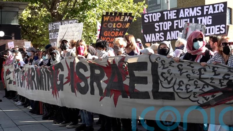 Three arrested after protest outside defence event