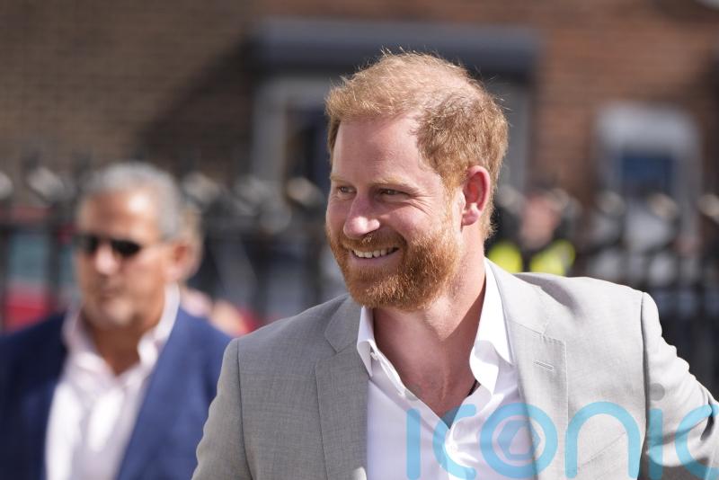Duke of Sussex met with cheers from crowd of fans ahead of charity donation