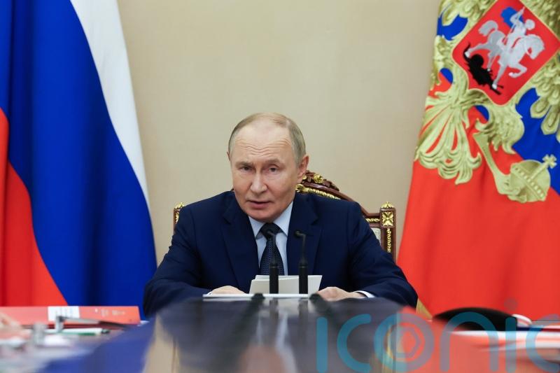 Putin says Russia will stick to nuclear arms limits for one more year