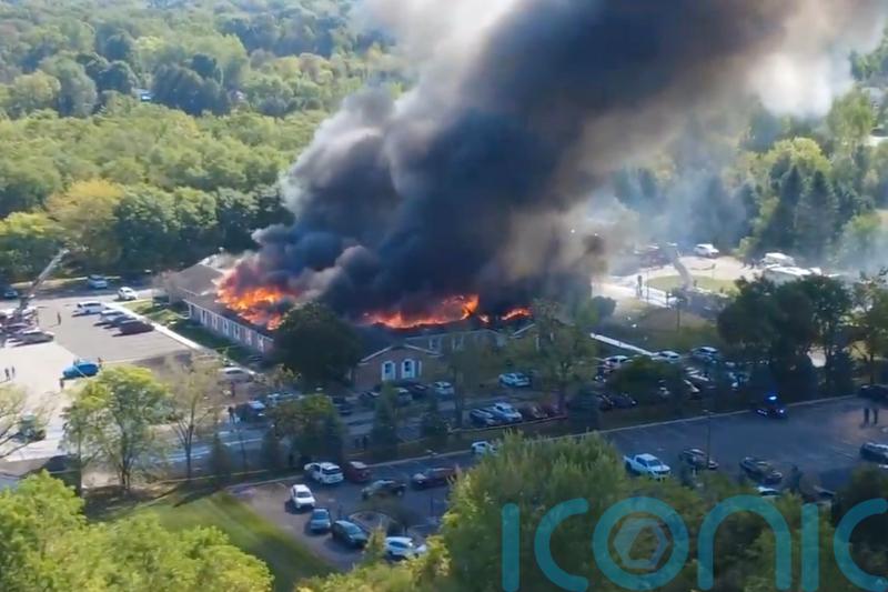 Two dead and eight injured in shooting and fire at Michigan church, say police