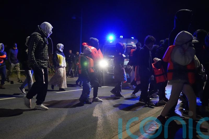 Riot police stop migrants from reaching beach in French town