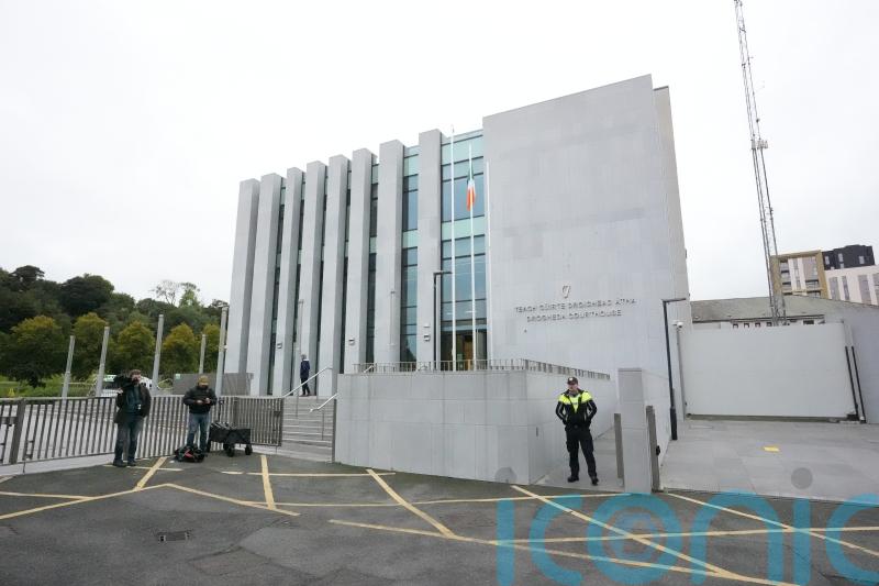 Man charged with murder of his parents and brother