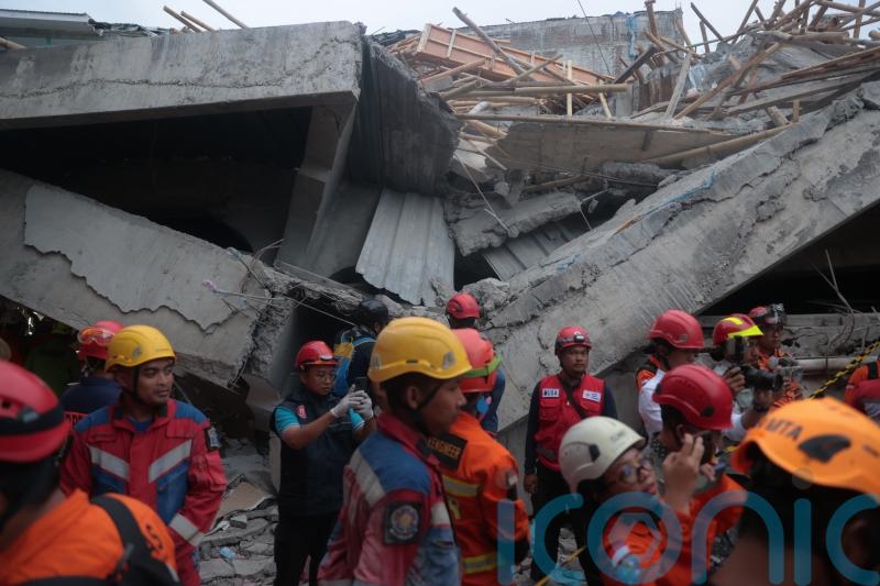 At least 91 students remain buried in rubble after Indonesia school collapse