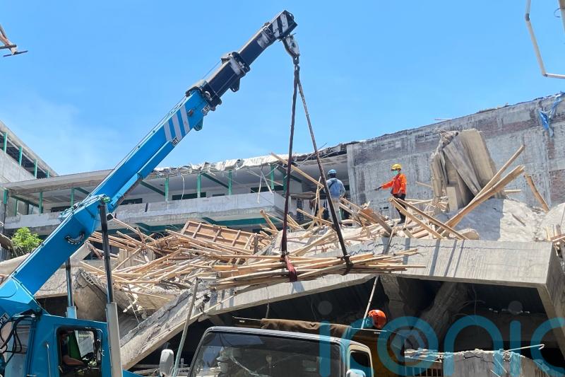 Rescuers use heavy machinery as hopes fade of finding school collapse survivors