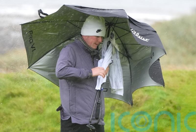 Robert MacIntyre battles brutal conditions to take share of lead on home soil