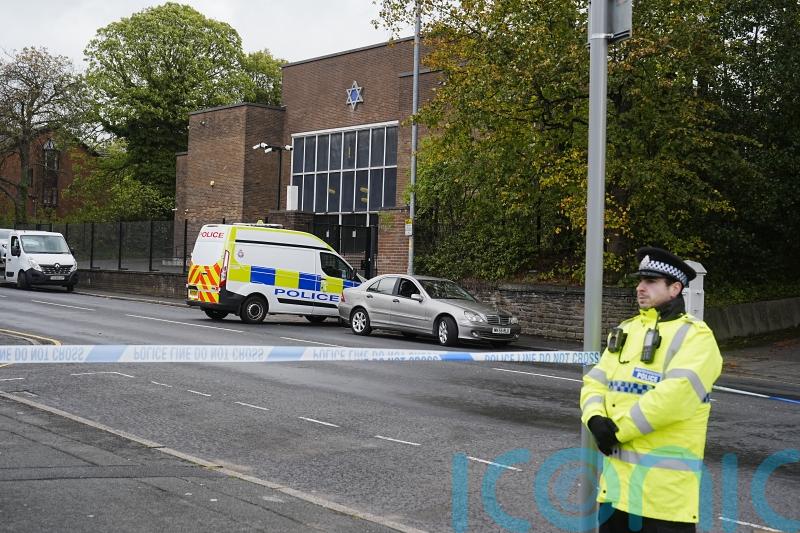 Bravery of synagogue attack victims remembered as first funeral takes place