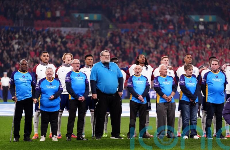 Football fans with dementia walk out with players for England-Wales match