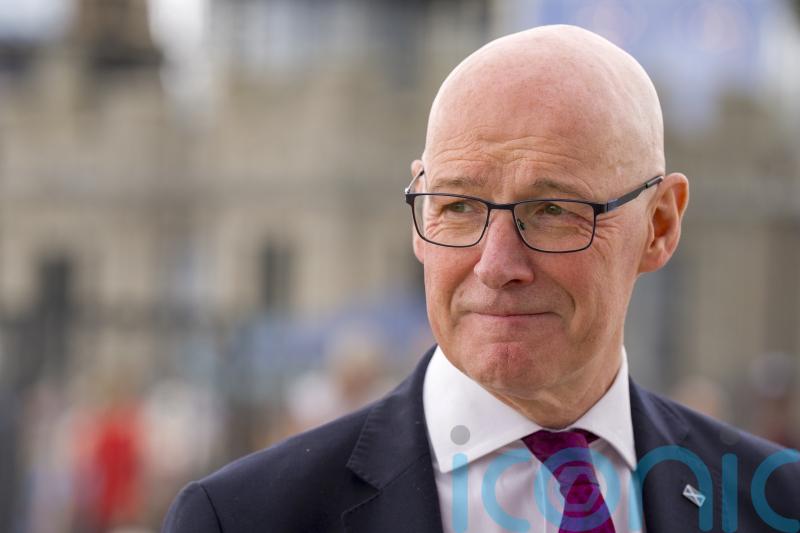 We have to try and get on, says Swinney of Trump