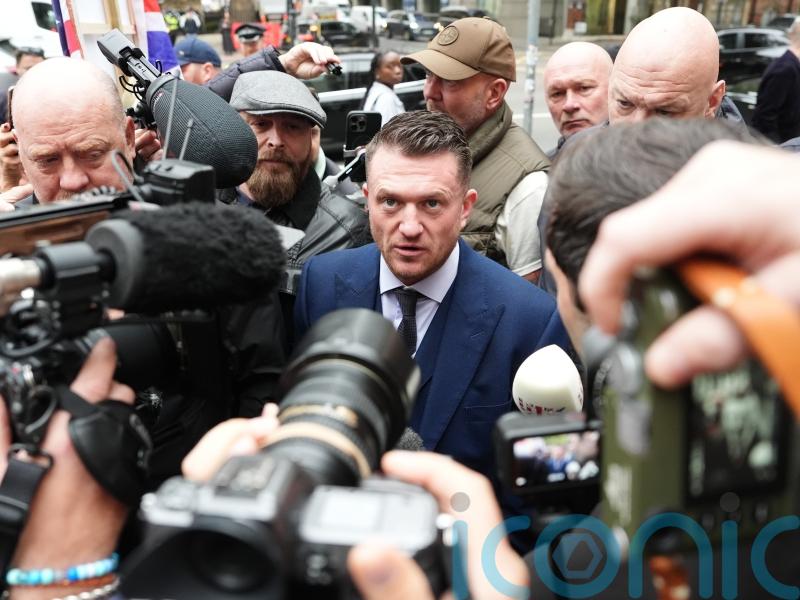 Tommy Robinson arrives in court for trial charged under Terrorism Act