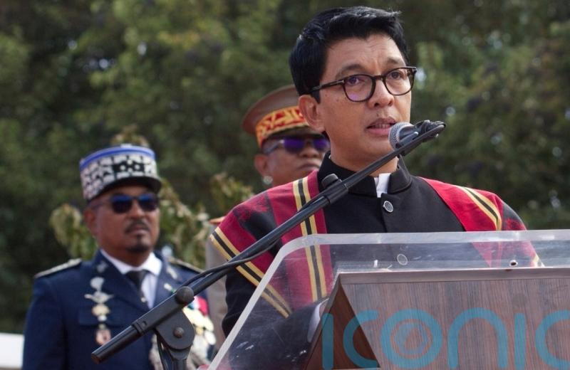 Madagascar president leaves country after soldiers turn against him