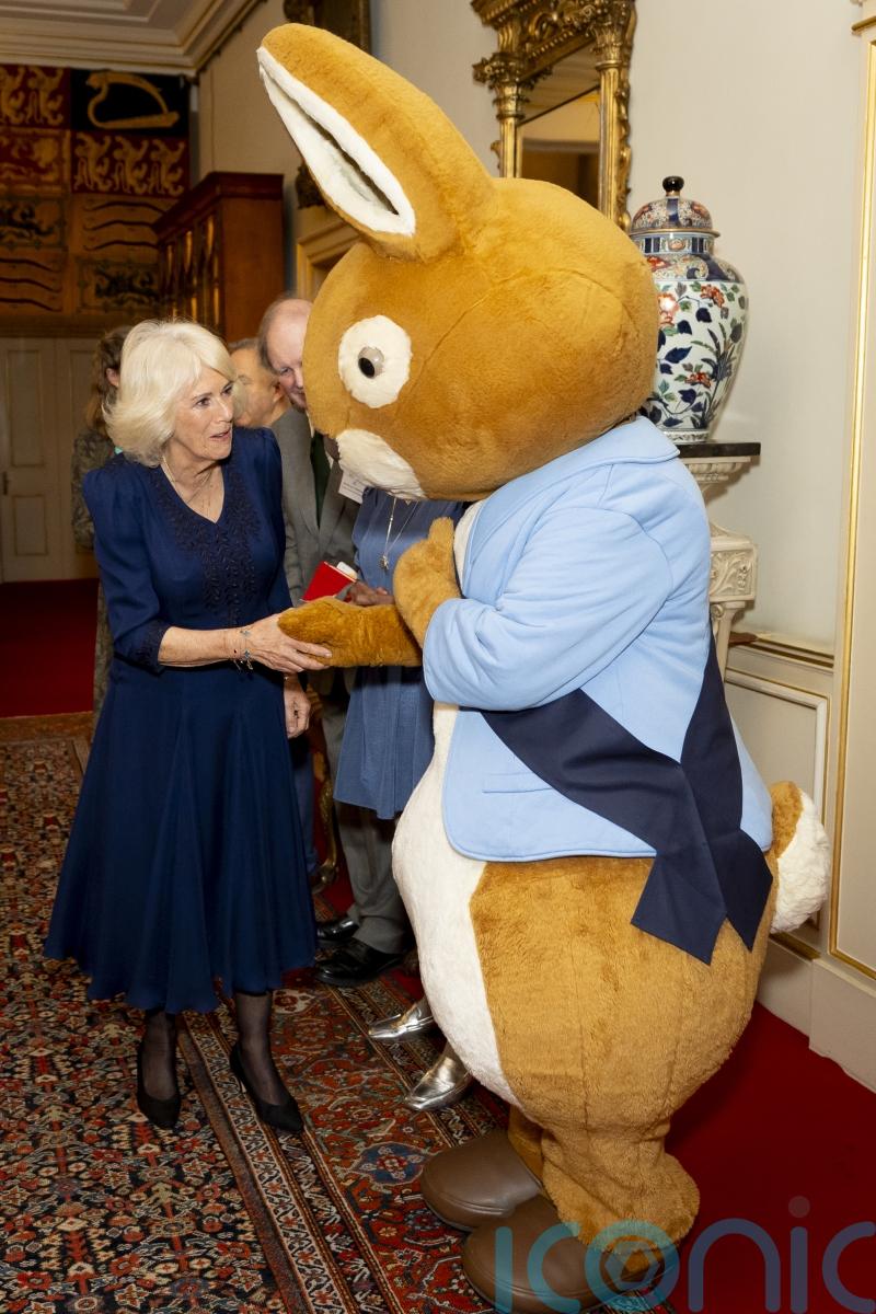 Queen meets Peter Rabbit as she wishes reading charity ‘happy 100th birthday’