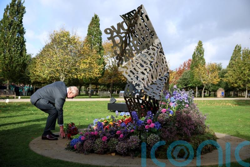Charles lays flowers at first national LGBT armed forces memorial