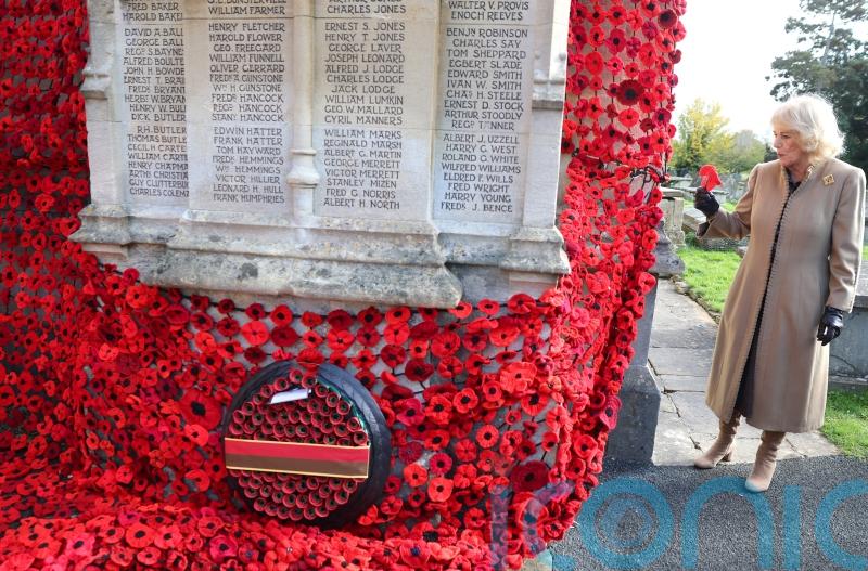 Queen pins final poppy on huge war memorial display