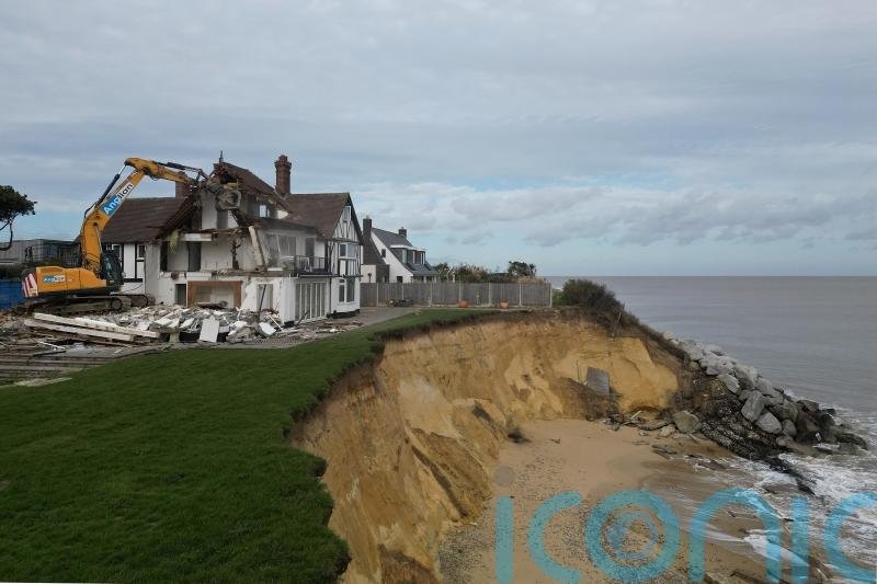 Demolition of clifftop home threatened by coastal erosion under way