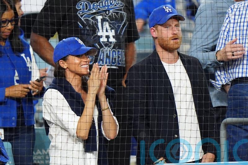 Harry and Meghan cheer on the Los Angeles Dodgers from front row seats