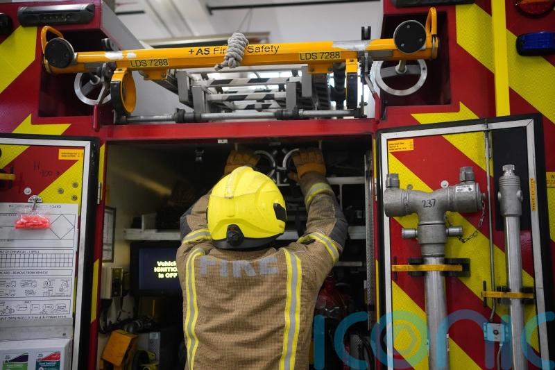 Road closed as firefighters tackle house fire