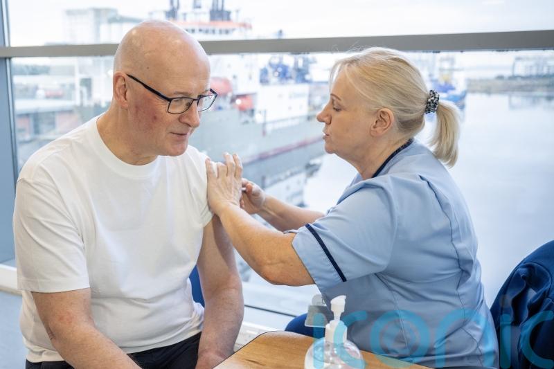 Swinney has flu jab and warns vaccine ‘crucial’ to protecting NHS this winter