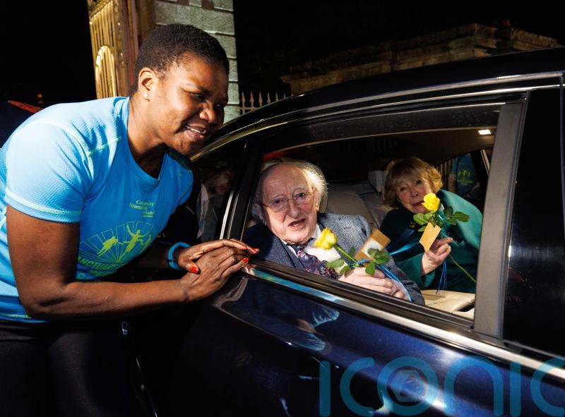 Michael D Higgins and Sabina given roses and cheered as term ends