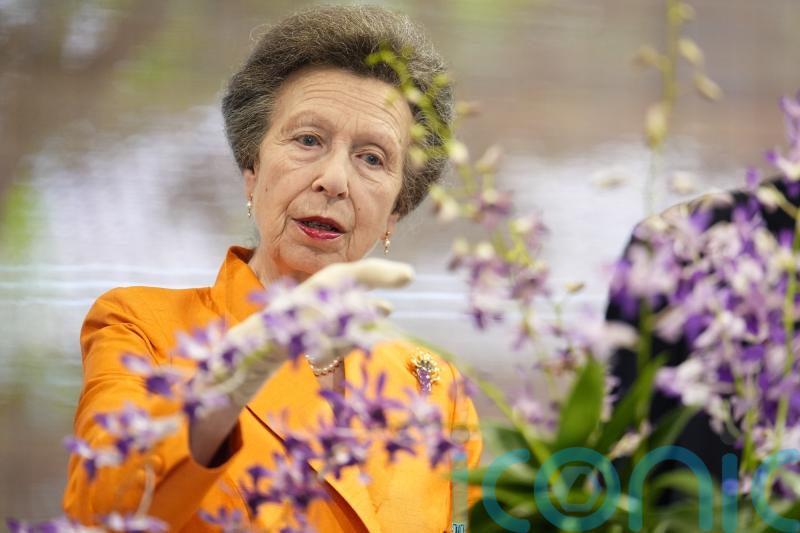 Anne admires flower named after late royal in Singaporean botanic garden