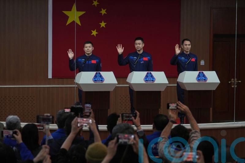 Chinese astronauts return from space station after delay blamed on space debris
