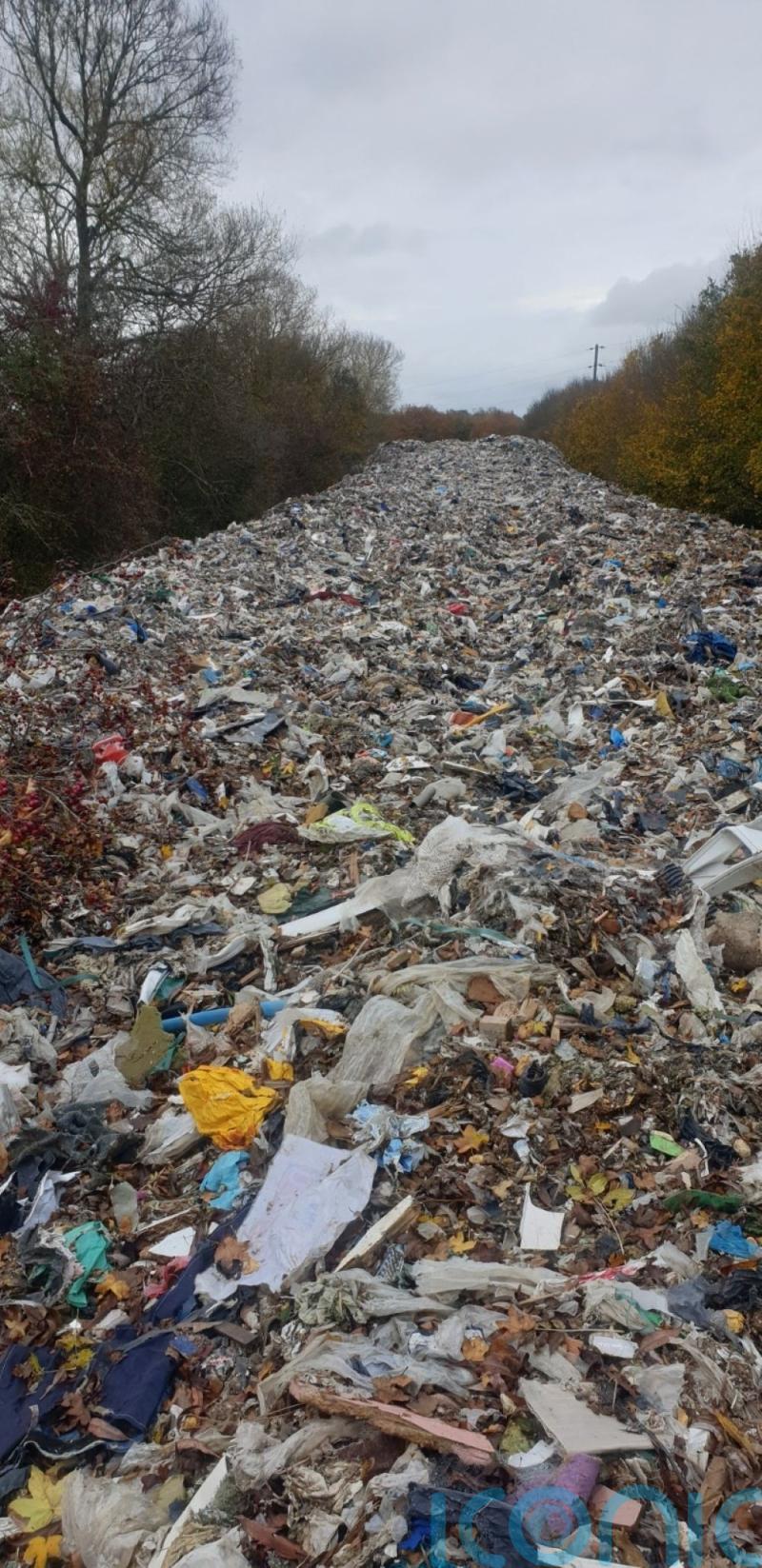 Fly-tippers dump &lsquo;mountain of illegal waste&rsquo; near river