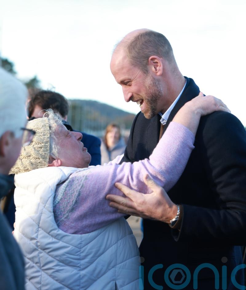 William hugged by well-wisher as he meets young marine conservationists