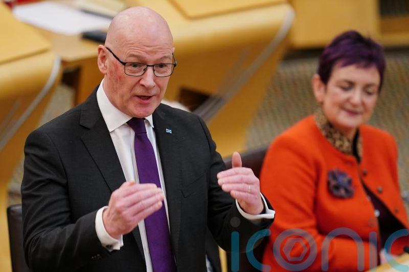 We stand ‘shoulder to shoulder’ with unions against discrimination, says Swinney
