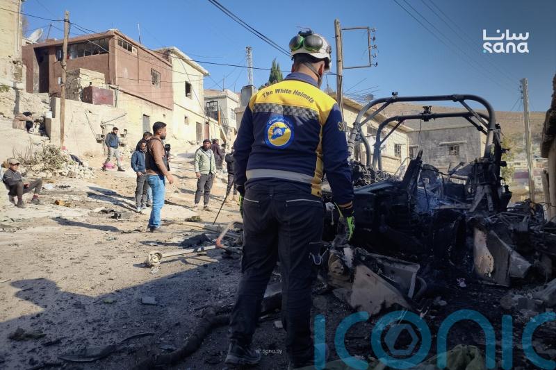 Israeli forces kill at least 13 people in southern Syria raid, officials and residents say