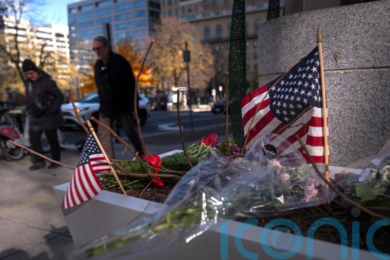 US halts asylum rulings as National Guard shooting suspect faces murder charge