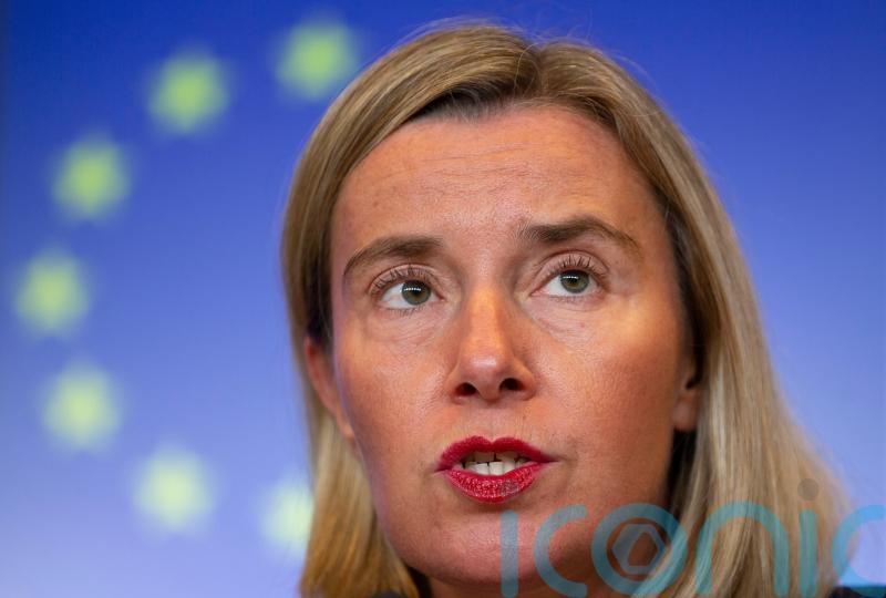 Former EU foreign policy head quits roles amid fraud investigation