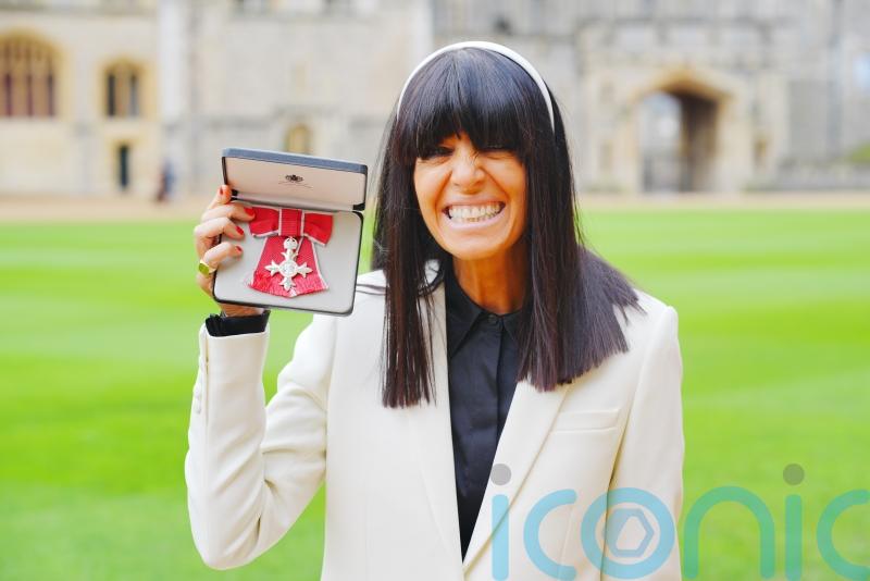 Claudia Winkleman smiles ear to ear after officially being made an MBE