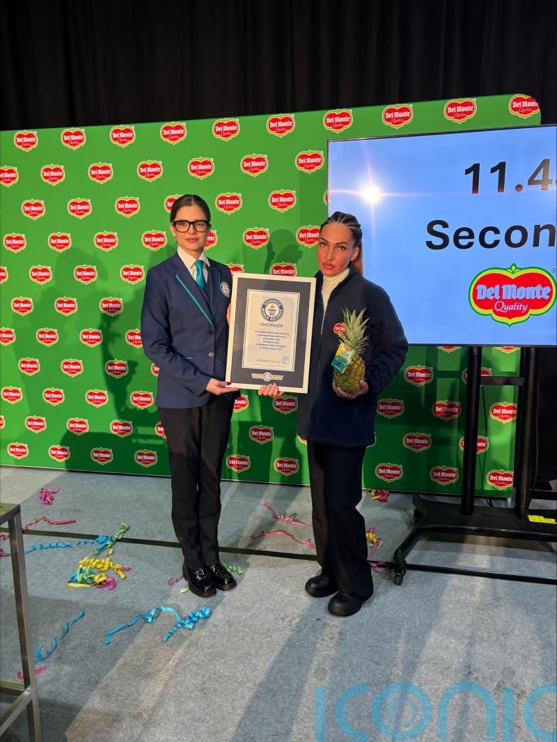 A cut above: Factory worker breaks world record to peel and slice a pineapple