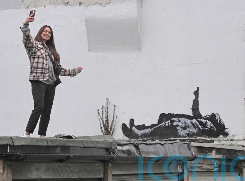 Banksy claims Bayswater artwork that shows two figures lying down