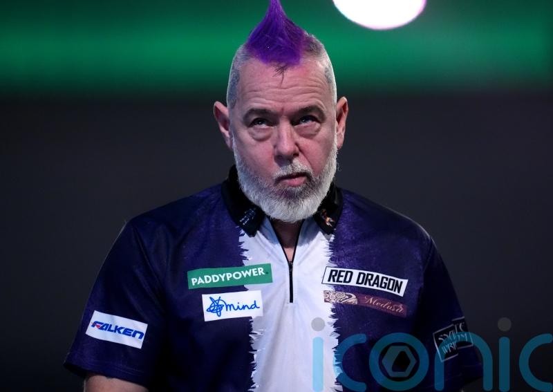Peter Wright crashes out in round two after predicting he would win title