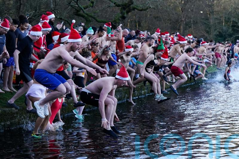 In Pictures: Hardy swimmers and royal watchers brave cold Christmas Day