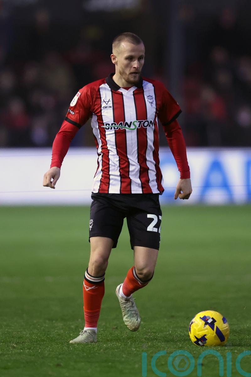 Lincoln maintain League One promotion push with victory at Barnsley