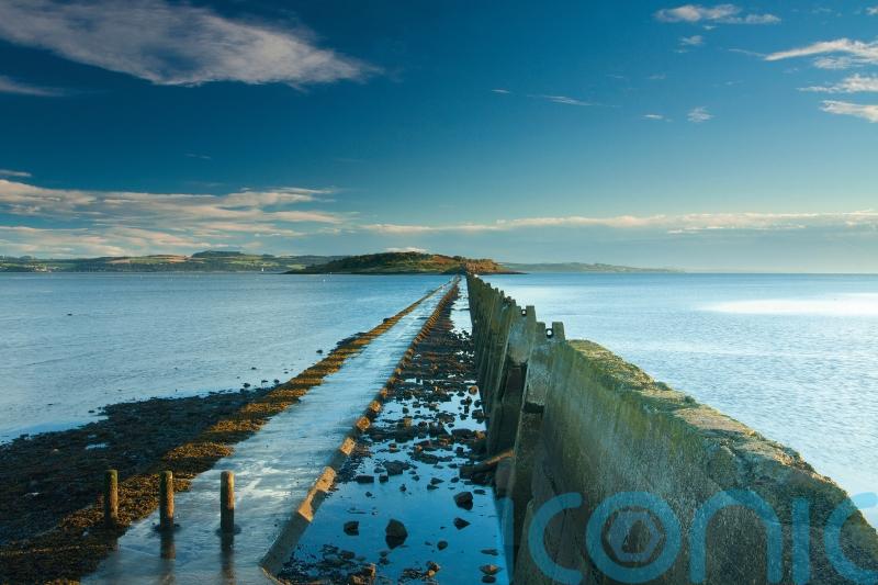 Three people rescued after being cut off by tide on island