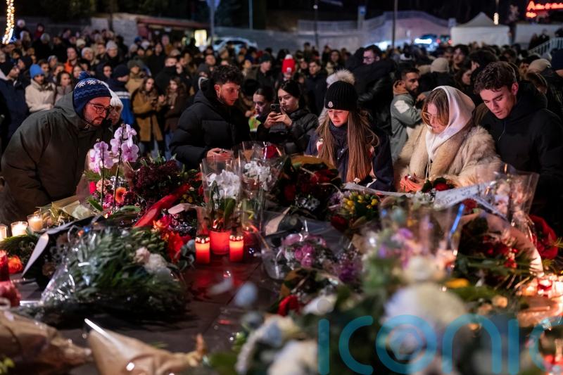 Swiss investigators believe sparkling flares in wine bottles ignited fatal fire