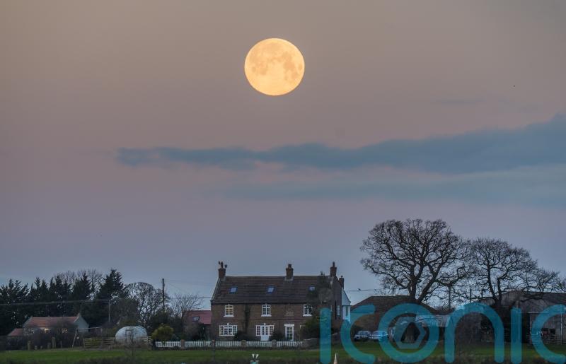 Wolf supermoon appears in clear UK skies
