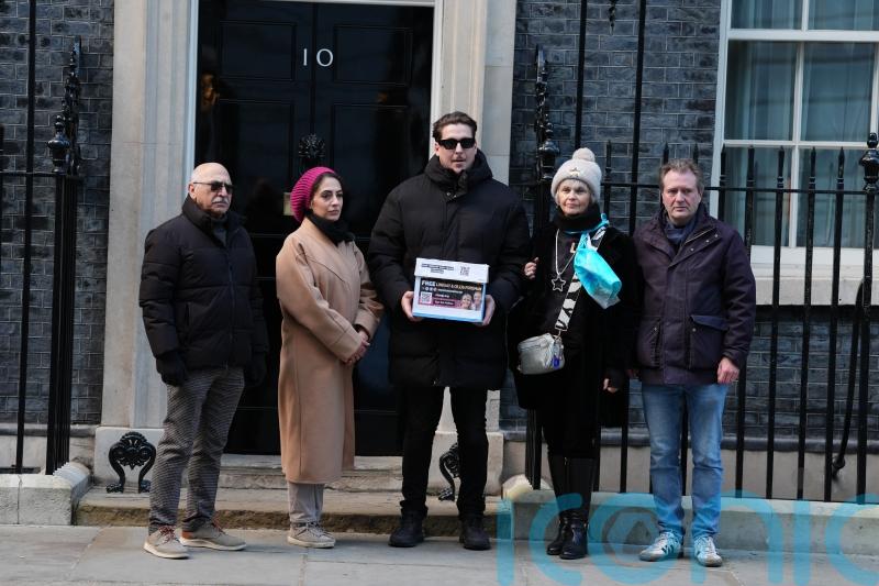 Family of UK couple detained in Iran and supporters hand petition to No 10