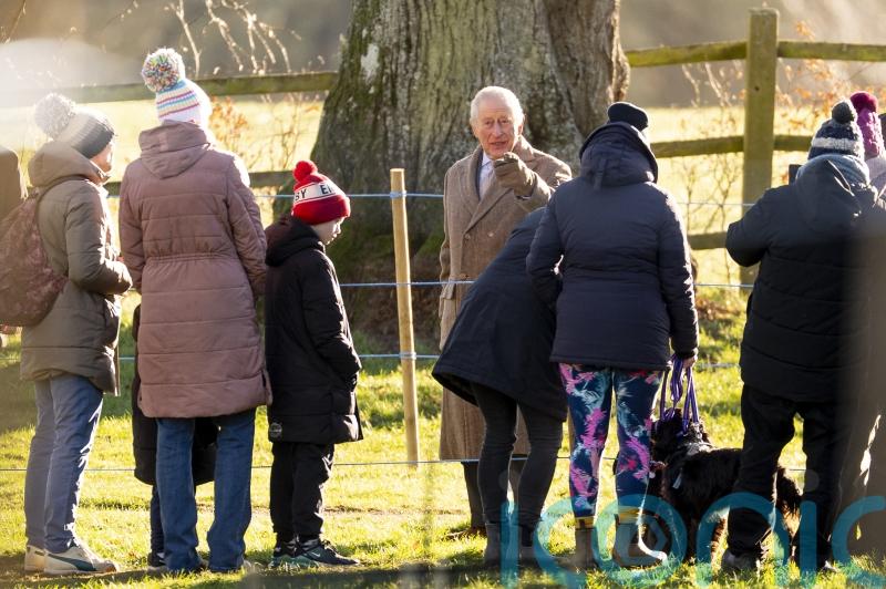 King meets child on a tricycle after Sandringham church service
