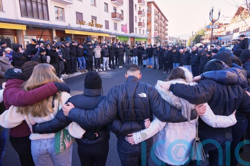 Hundreds march in silence to honour victims of Swiss bar fire
