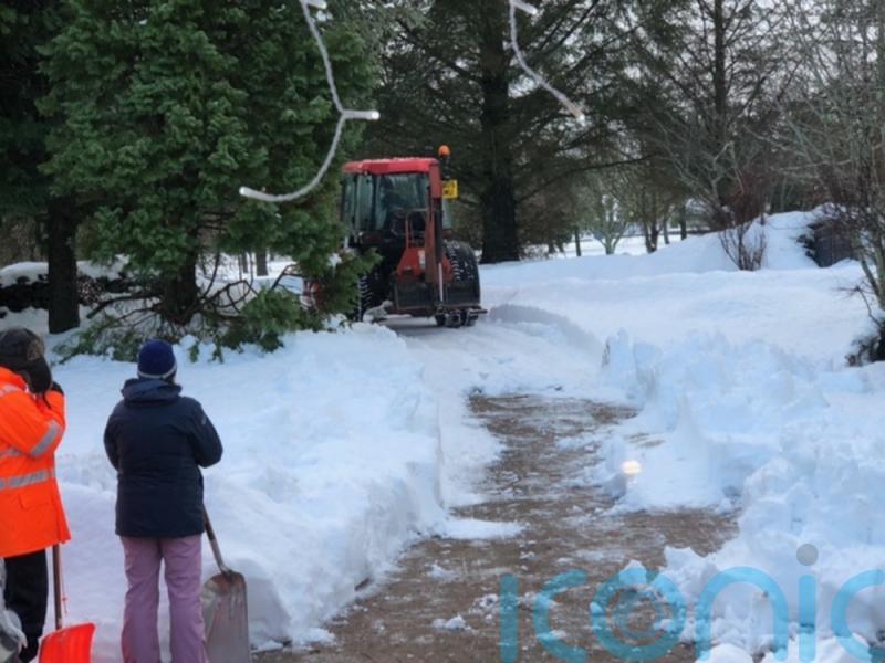 Snowed-in couple hail &lsquo;good Samaritan&rsquo; farmer who cleared drive